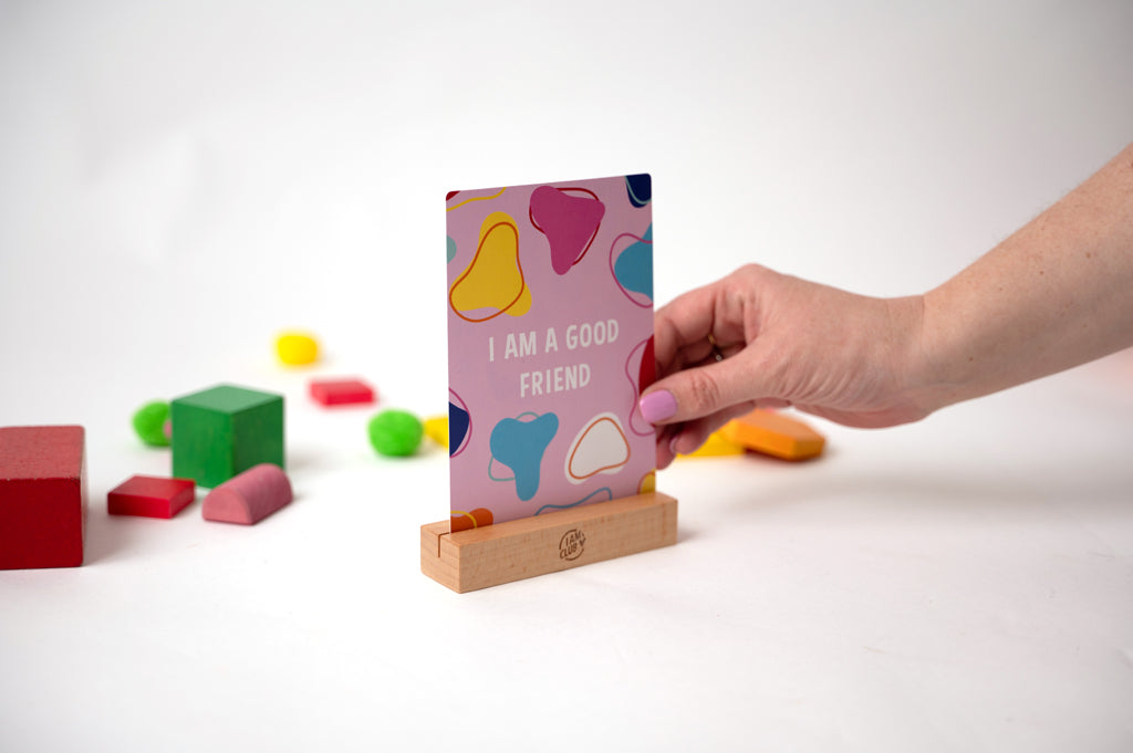 i am a good friend affirmation cards for children in a wooden stand