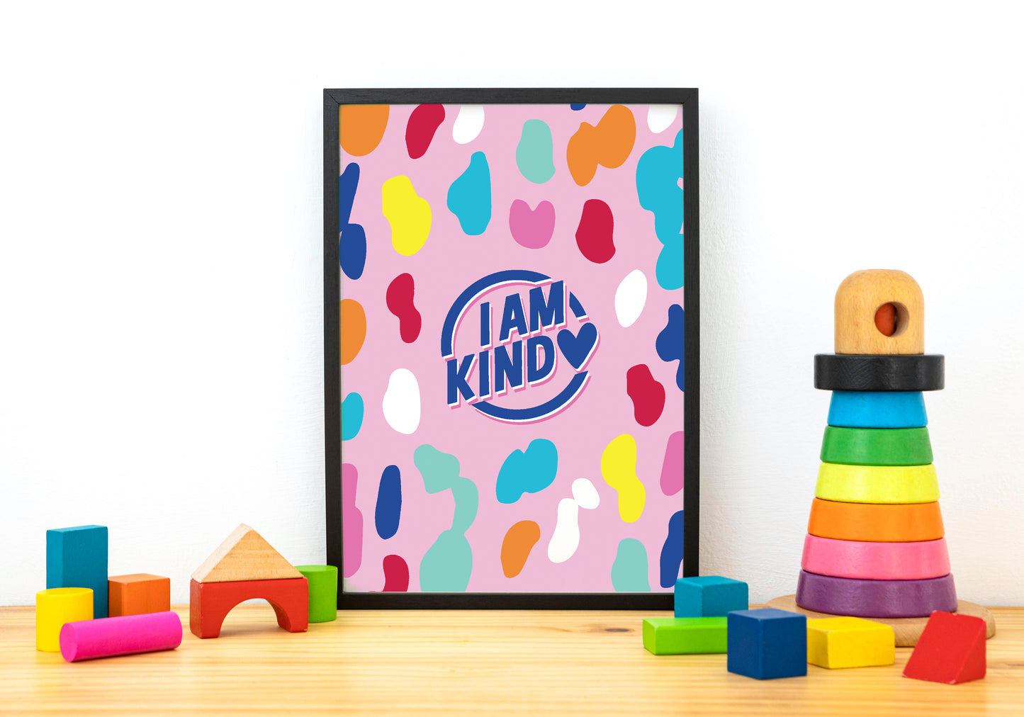 i am kind poster in pink with a bold pattern with black frame