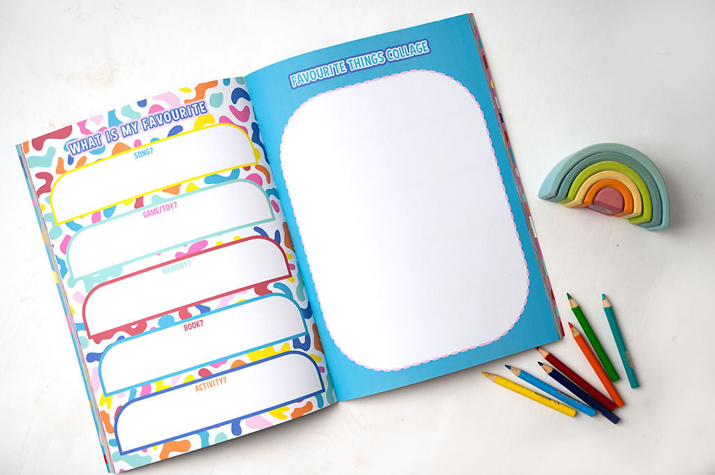 this is me journal open with the what is my favourite page open, lay flat with some colouring pencils and wooden rainbow
