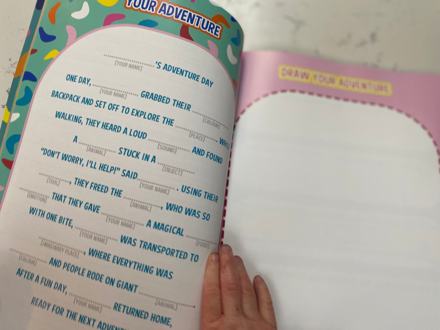 your adventure page opened by a little hand