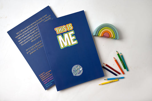 Blue this is me journal for kids, lay flat with some colouring pencils and wooden rainbow.