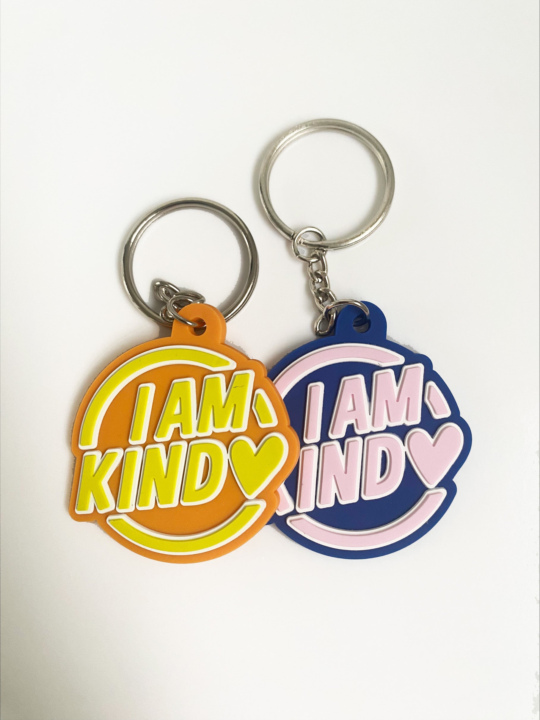 orange and yellow with blue and pink i am kind affirmation keyrings